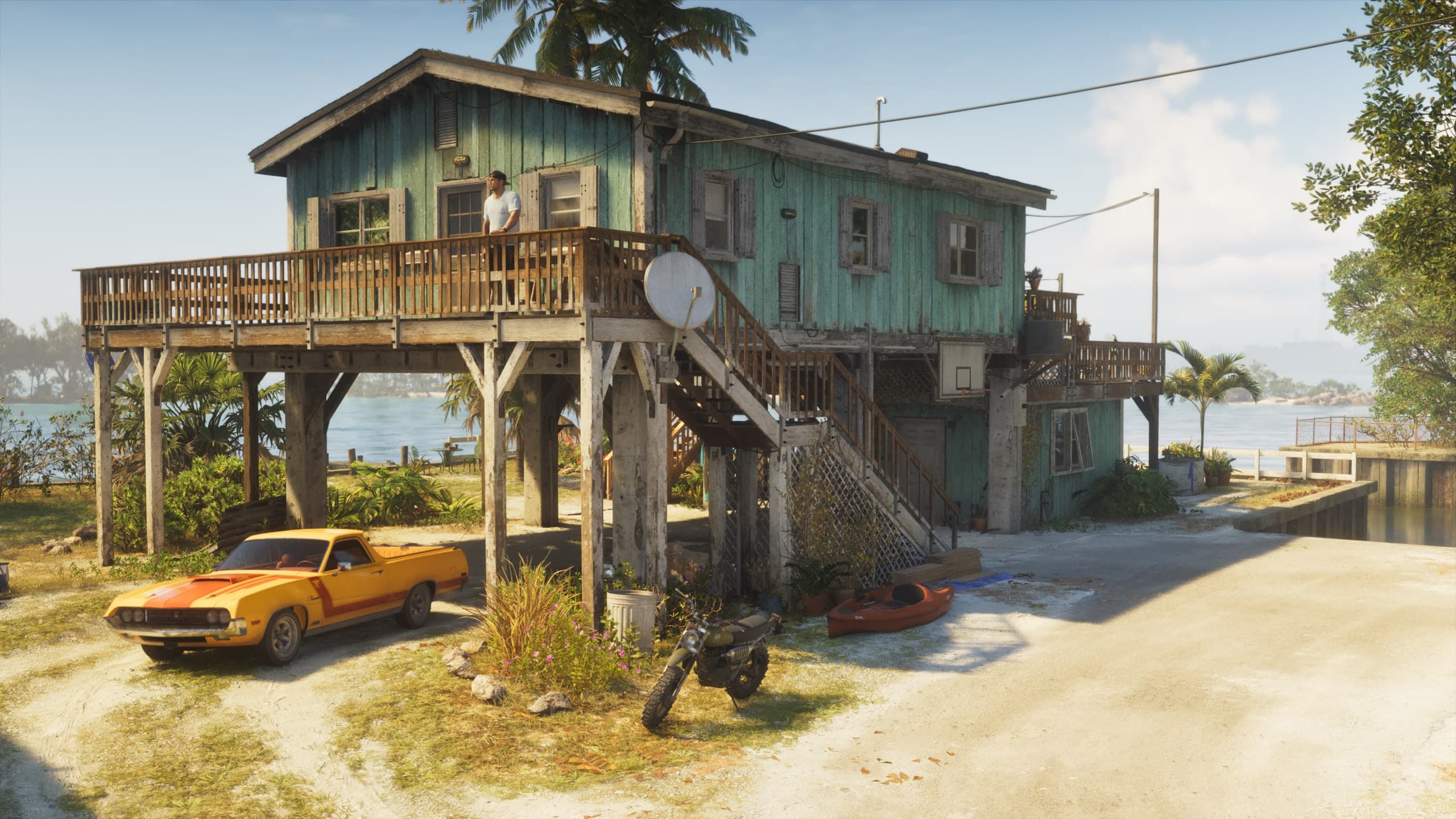 Casa de palafita em Leonida com veículos estacionados embaixo, em captura de tela oficial de GTA VI — o tipo de esconderijo descrito pela Rockstar