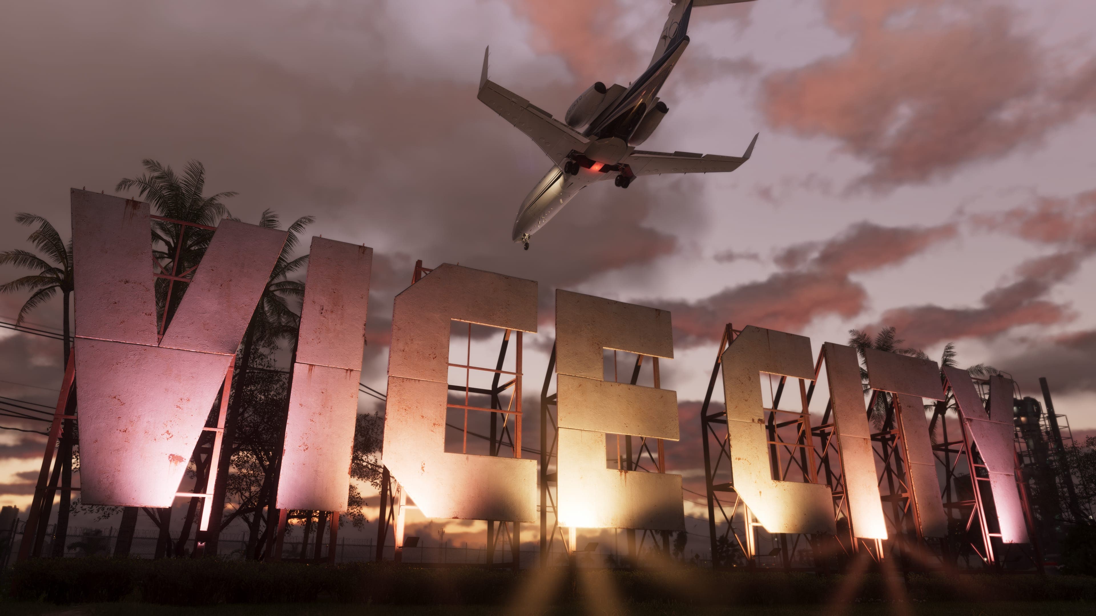 Letreiro gigante de Vice City ao entardecer com um avião passando, em captura de tela oficial de GTA VI usada como ilustração — a imagem não mostra os quiosques do Kaseya Center